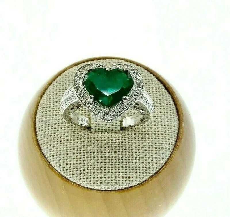 Lab Grown Diamond Engagement Rings2.08 Carats t.w. Diamond and Emerald Halo Ring 18K Gold Emerald is 1.68 Carats