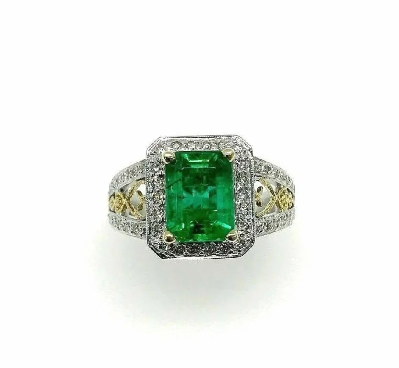 Prong Set Engagement Rings3.19 Carats t.w. Diamond and Emerald Halo Ring Emerald is 2.40 Carats 18K 2Tone