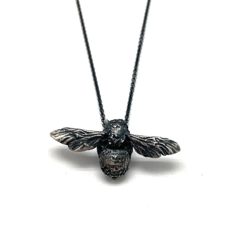 Layered pendant necklaces with multiple charms for an eclectic, trendy look -Naturalist Bee Necklace