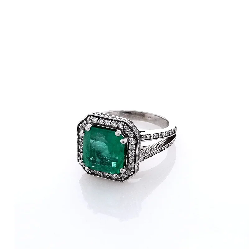 Rings crafted with recycled gems for green vibes -Estate Jewelery 18k White Gold Emerald and Diamond Halo Split Shank Ring